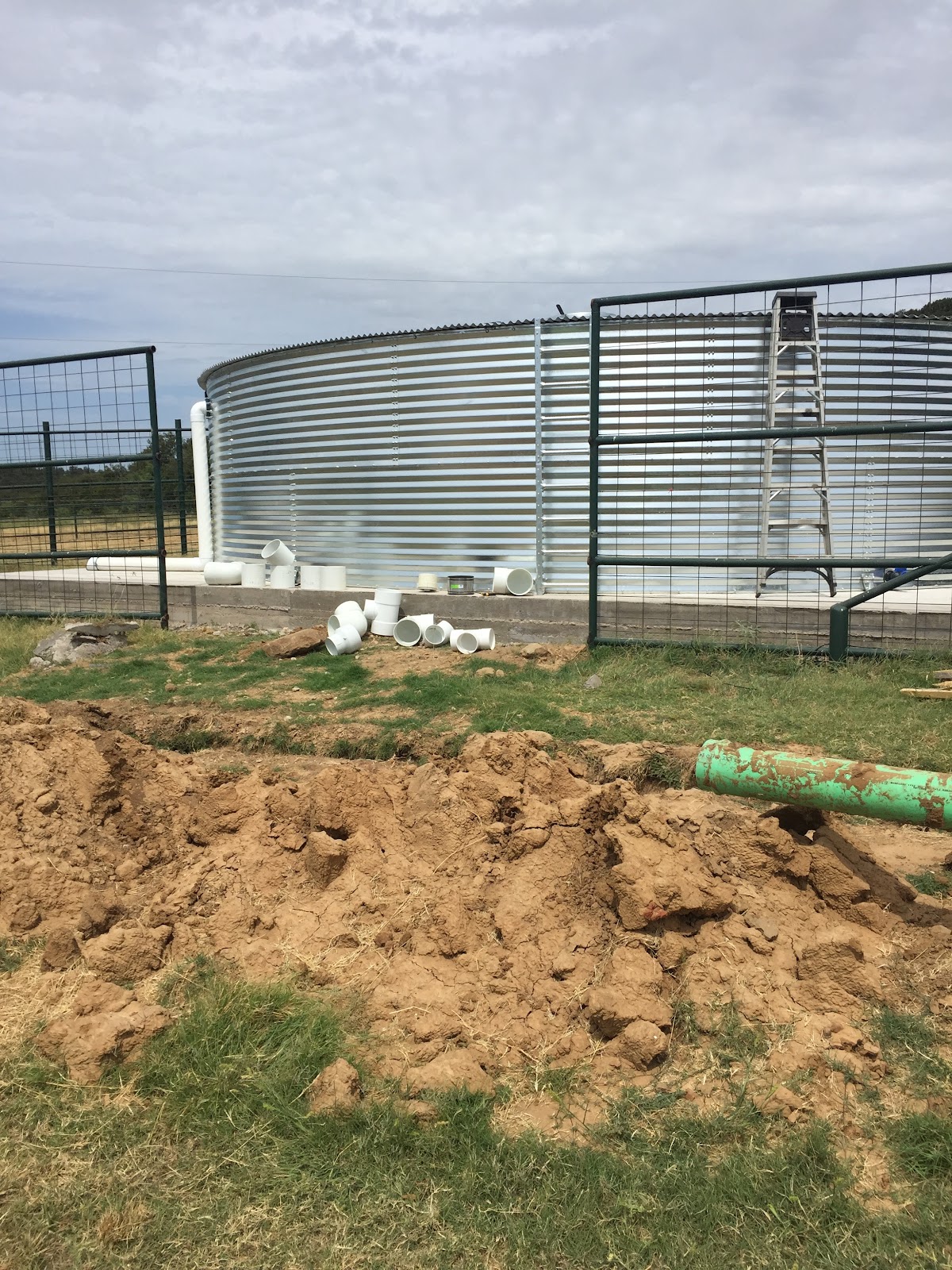 PVC plumbing installation at large water cistern